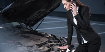 Women broken down in car park calling roadside assist