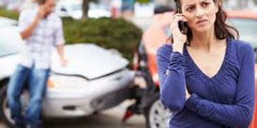 women calling for towing assistance at an accident scene