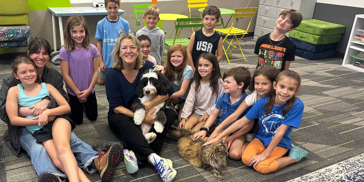 A picture of students and kids at the summer camp