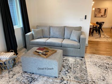 Gray sofa and ottoman set in customer living room