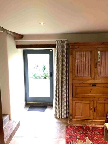 A single sided, interlined wave curtain over a kitchen door
