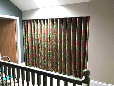 An interlined, velvet wave curtain.  Made to fit inside the recess of the window