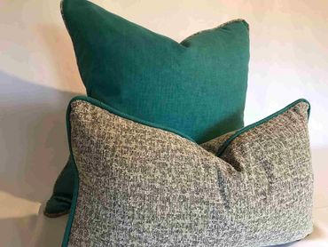 bespoke scatter cushions with piping.  The fabrics are contrasting to each other