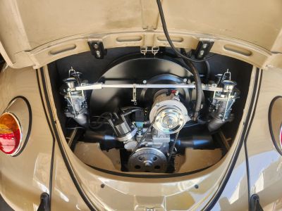Vintage car engine bay with polished components.