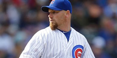 Phil Coke pitching for the Chicago Cubs