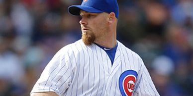 Phil Coke pitching for the Chicago Cubs