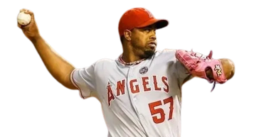 Baseball player from Angels pitching with intensity.