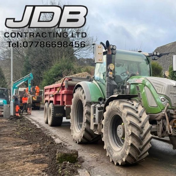 Construction site with tractor and workers.