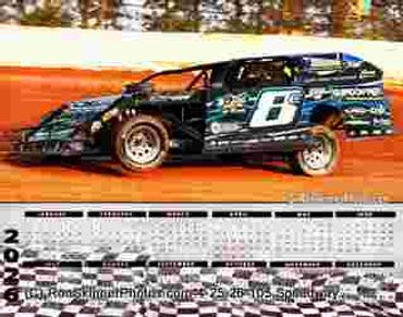 Black race car number 6 speeding on a dirt track.