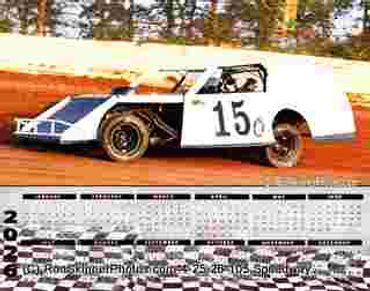 A white and blue race car with number 15 on a dirt track.