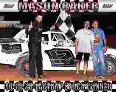 Race car winner with two fans holding a checkered flag.