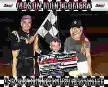 Three people celebrating a racing win with a checkered flag and a large prize check.