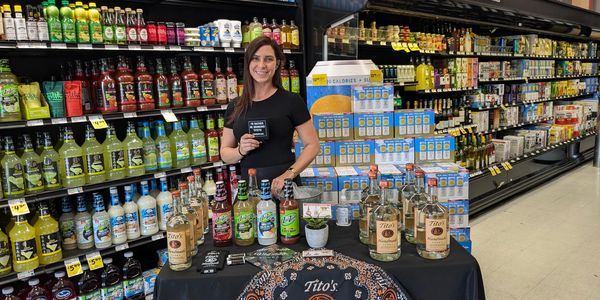 Thomas & Hobbs Marketing brand ambassador at a Tito's Handmade Vodka retail product display in a gro