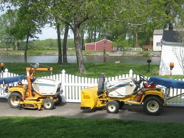 Alpha, and Bravo PRONETRACTORS. One set up for snow the other set up for mowing the lawn.