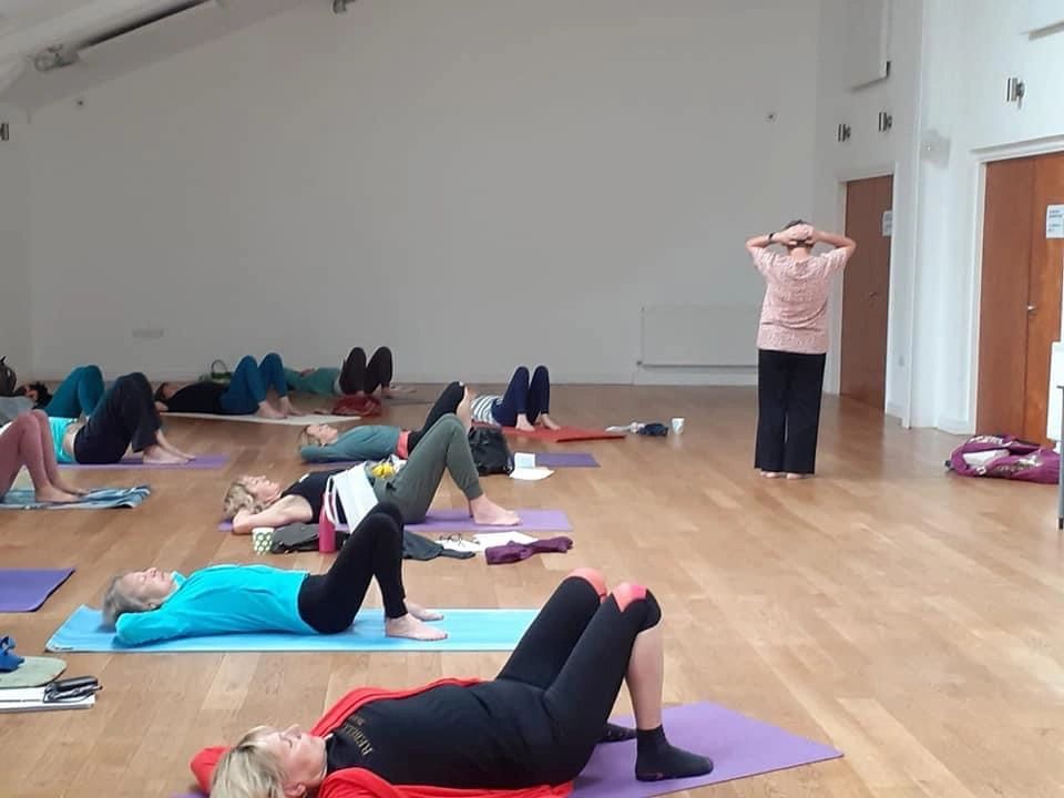 Arch and flatten with a curl. Cultivating body awareness with somatic yoga techniques
