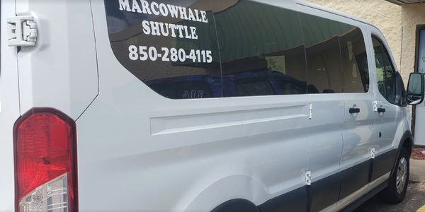 Side view of the Marcowhale Shuttle text on the car glass