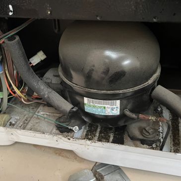 Compressor unit inside an appliance.