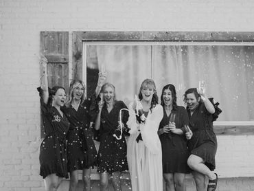 Group of women celebrating with confetti.