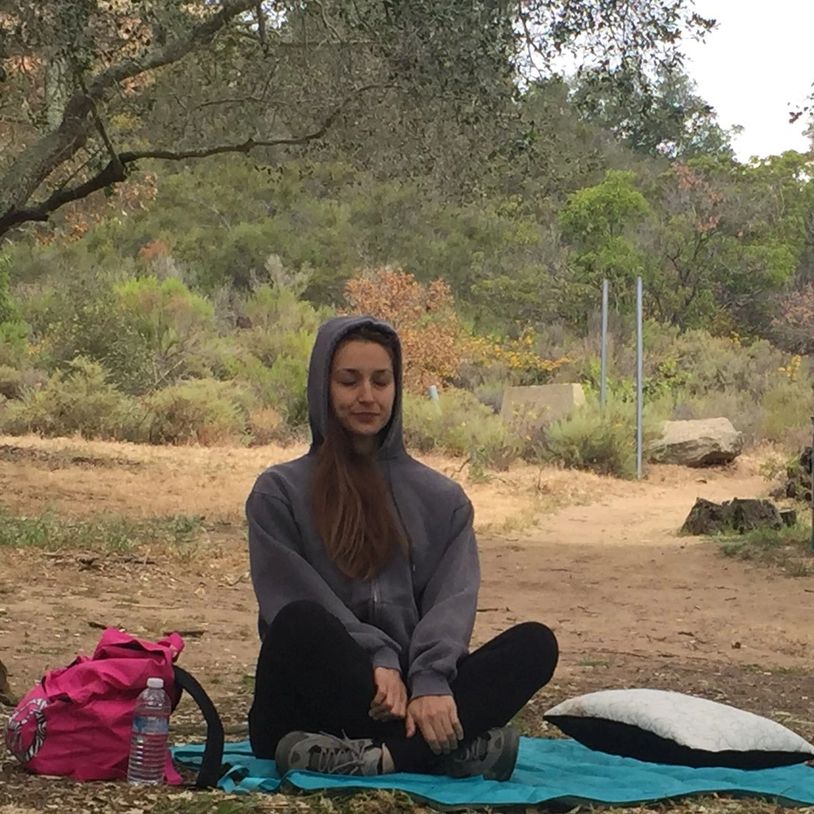 A beautiful sunset over a calm ocean, with vibrant colors reflecting on the water.