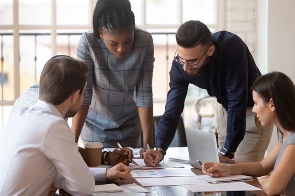 Focused multiracial corporate business team people brainstorm