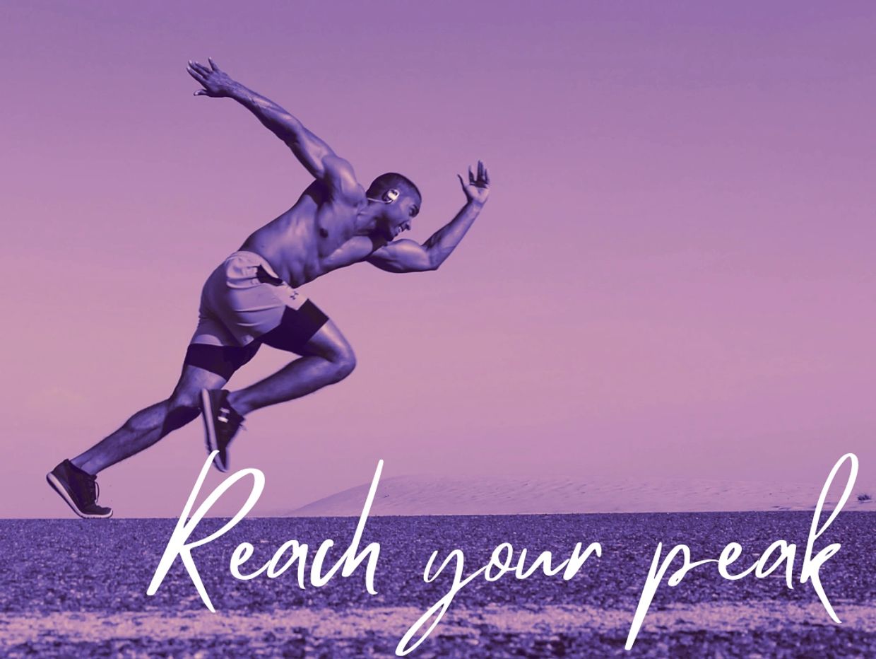 Athlete sprinting energetically with the motivational phrase 'Reach your peak'.