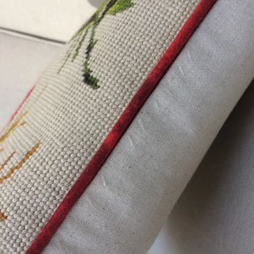 example of needlepoint pillow finishing with contrast welting