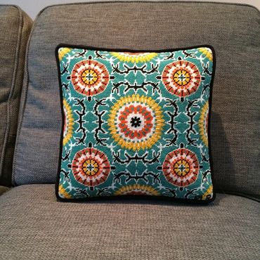 Geometric box pillow with gusset and welting