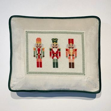 Needlepoint canvas inset into a fabric frame with contrast welt and gusset (boxed pillow)