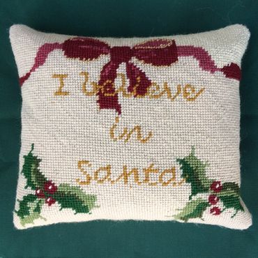 Needlepoint pillow finishing with a knife edge - no welting. The needlepoint touches the fabric.