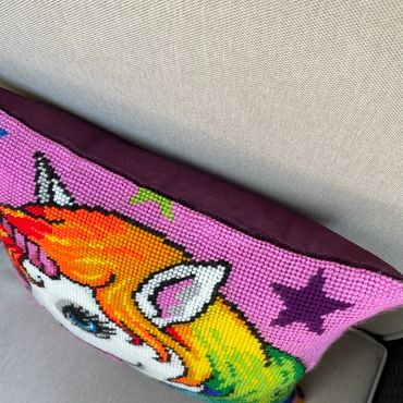 Vibrant unicorn needlepoint pillow finished with a knife edge - the needlepoint touches the fabric