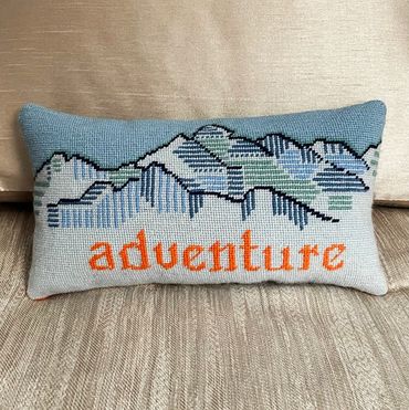 Small lumbar needlepoint pillow finished with a knife edge - the needlepoint touches the fabric