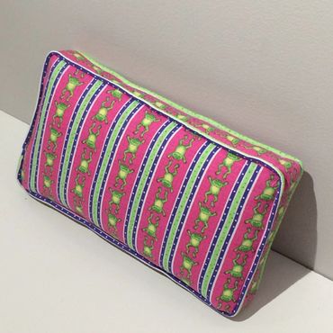 Box pillow with gusset and welting. Needlepoint on the front, customer's fabric on the back and side
