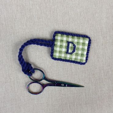 Needlepoint scissors minder