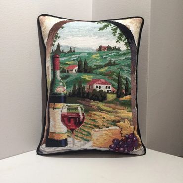 Simple welt cording adds depth to this needlepoint throw pillow