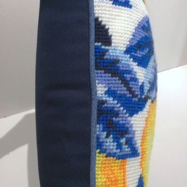 Contrast Welting - Side view of lemons pillow finished with denim welting and a navy backing 