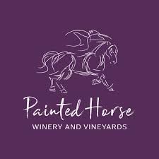 Elegant logo with a sketch of a horse and vineyard name on purple background.