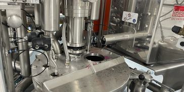 Industrial stainless steel machinery with pipes and control parts.