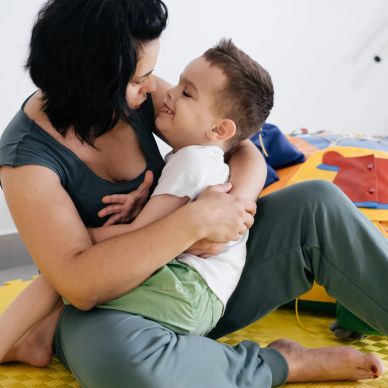 Mother and son sharing a warm hug.