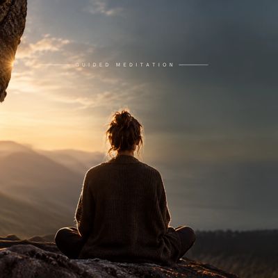 Person meditating outdoors at sunrise.