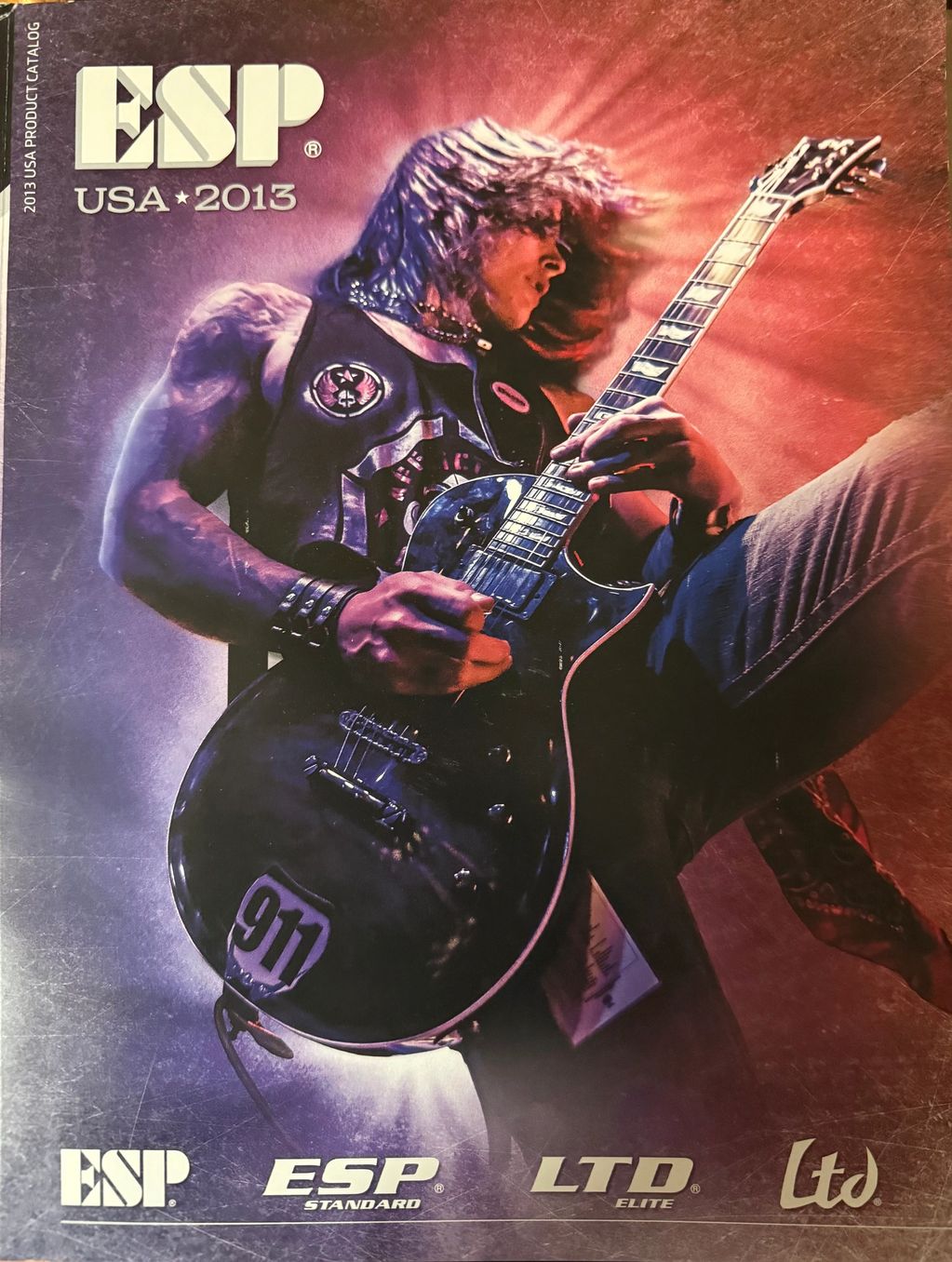 Guitarist playing electric guitar on ESP USA 2013 catalog cover.