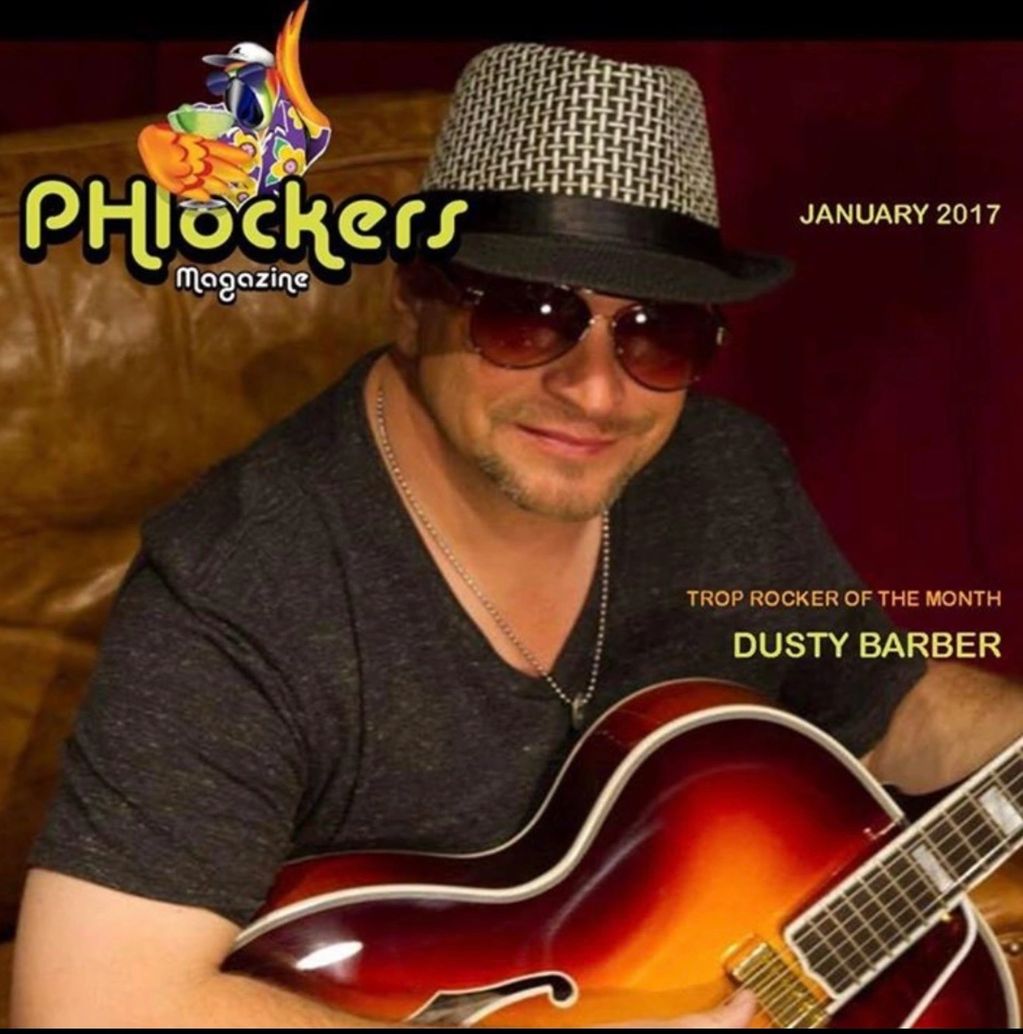 Magazine cover featuring musician Dusty Barber playing guitar.