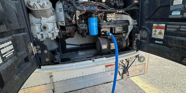 draining the oil of a Thermo King unit as part of a preventative maintenance program