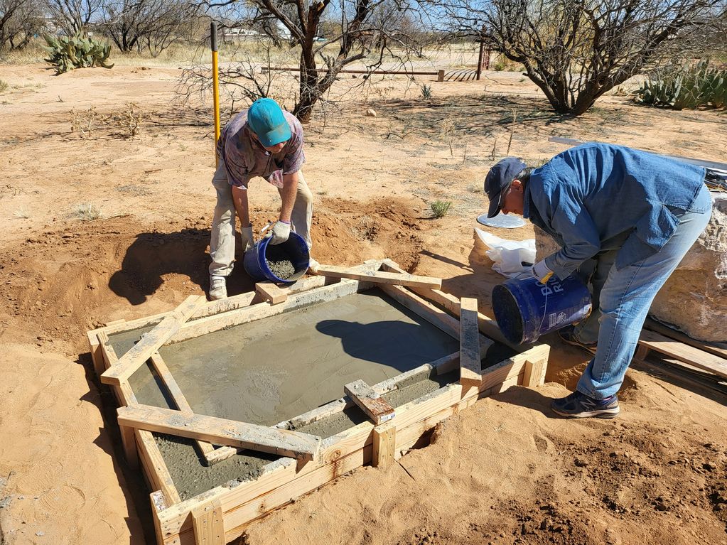 Building the footing to hold water for the statue basr