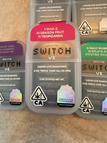 Boutiq Switch V5 cannabis product with multiple strain labels and CA warning symbols.