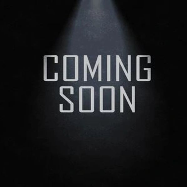 Minimalist black background with "COMING SOON" text under spotlight.