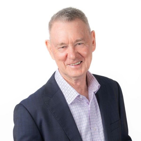 Smiling man in suit jacket and checked shirt
