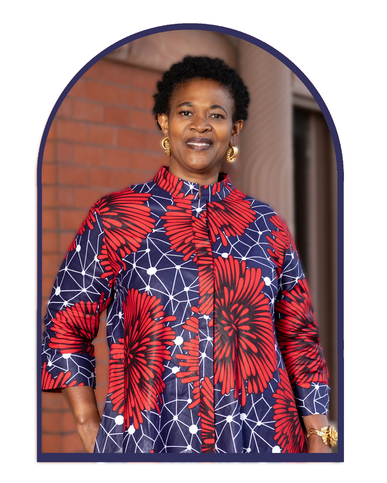  Astrid Coffi, founder of Coffico African Beauty and Fashion, standing confidently in a Dress.