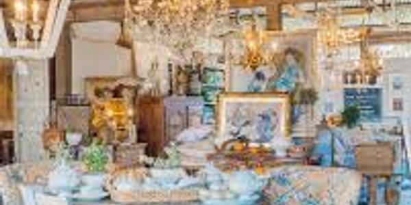 Cozy vintage-style cafe with elegant chandeliers and rustic decor.