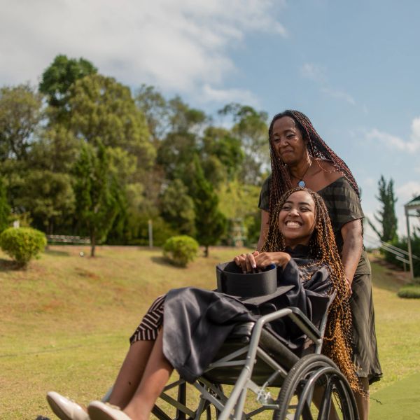Volunteer supporting disable woman