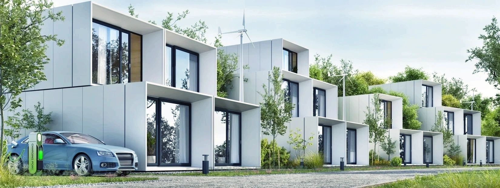 Modern eco-friendly homes with wind turbines and electric car charging station.